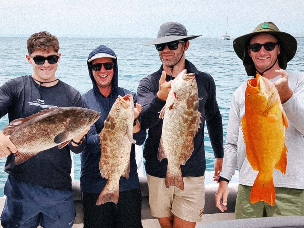 A group of anglers show off a strong catch of cabrilla and grouper during a fishing trip in the Sea of Cortez near La Paz.