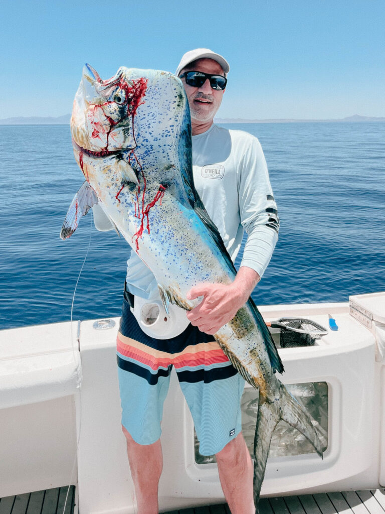 Angler Holding a Dorado Vertically – Sea of Cortez