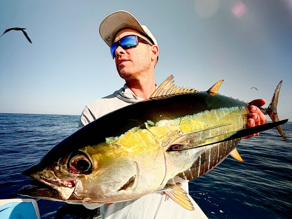 Angler Holding a Yellowfin Tuna Offshore
